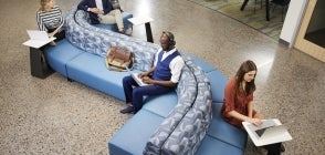 Thunderbird students work and socialize in the 3rd floor student lounge area